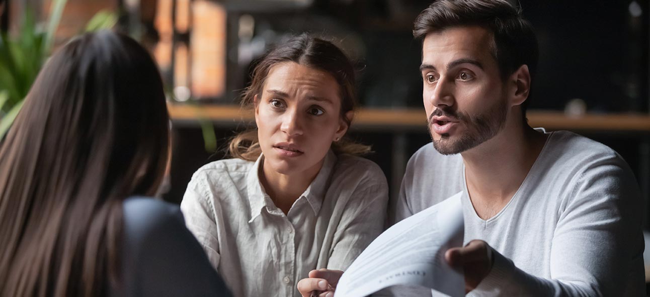 a couple explaining financial fraud