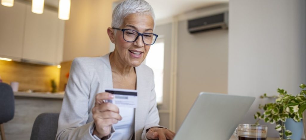 old woman making card payments online