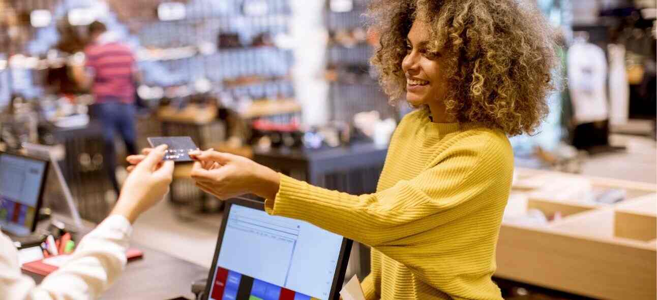 a young woman making card payment in the bill counter