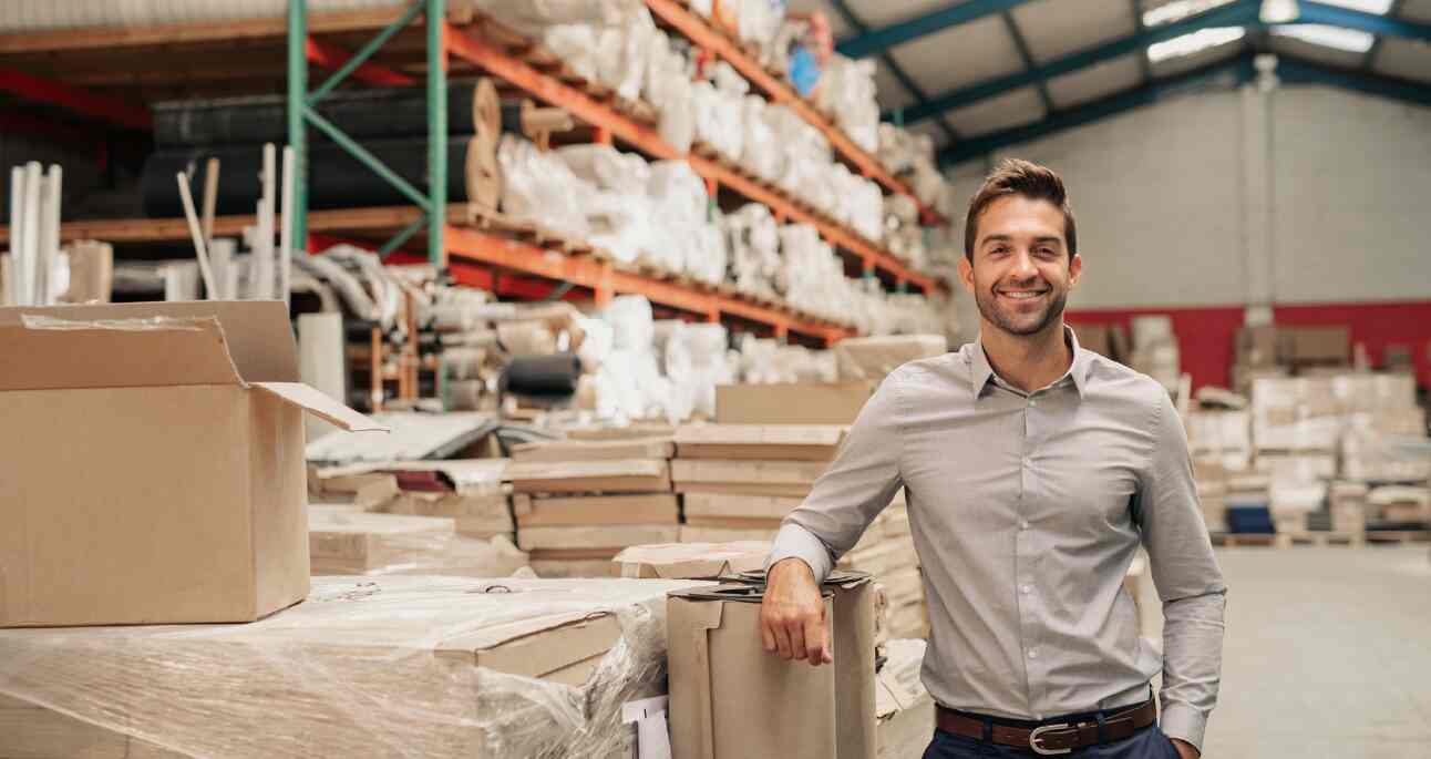 an entrepreneur standing in his warehouse