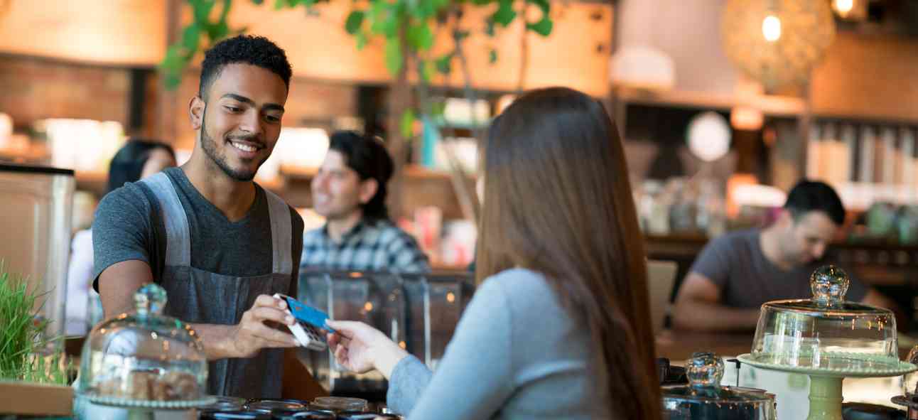 Customer making contactless payment in an outlet